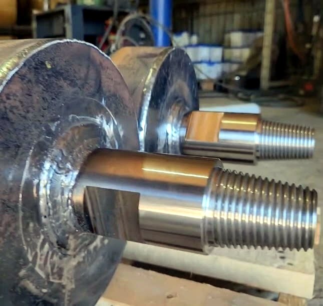 Machined threaded connections welded to fabricated steel plates
